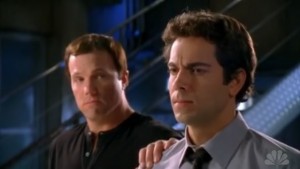 Casey rests a consoling hand on Chuck's shoulder.