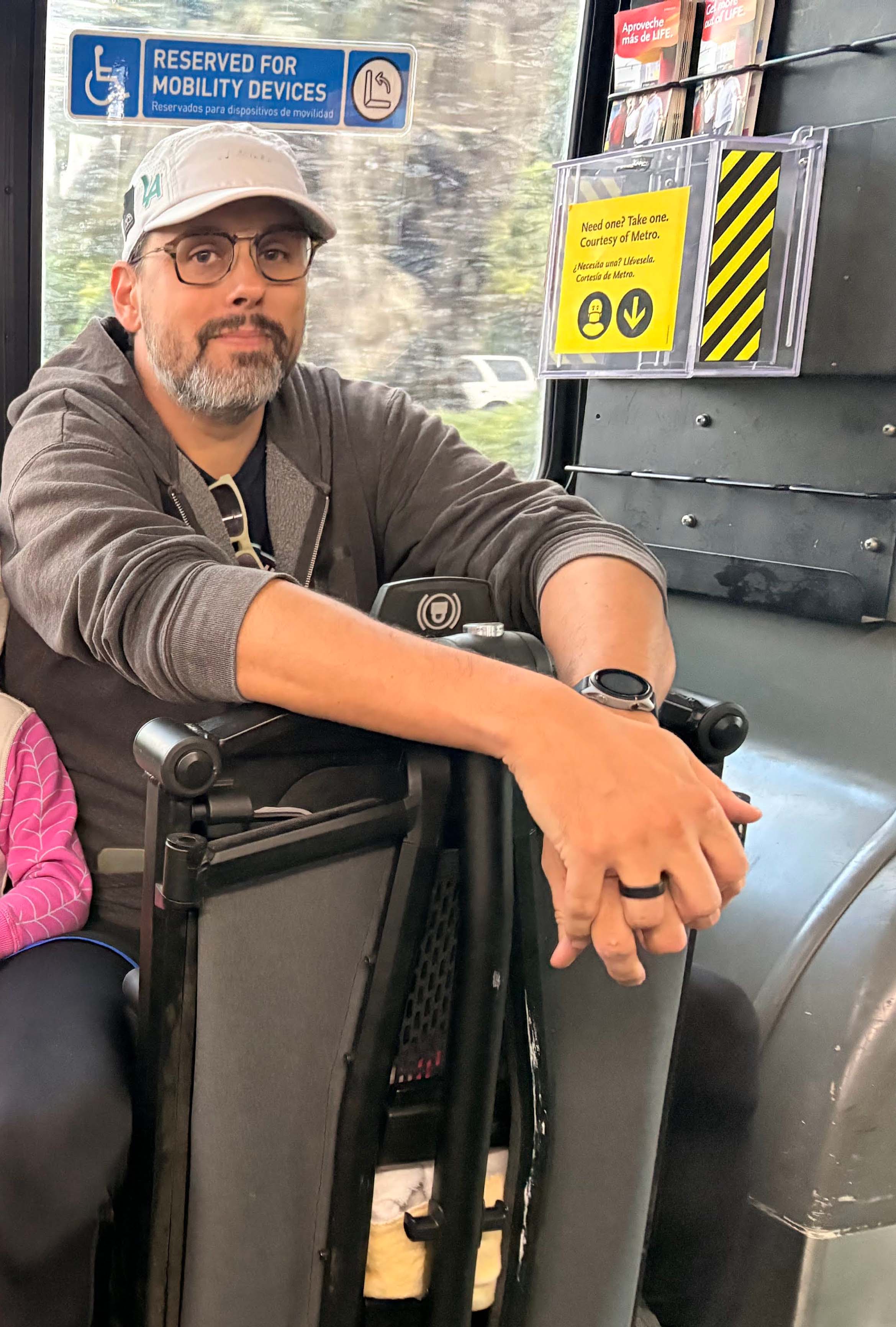 Me in an unfortunately necessary man-spread, child next to me obscured for her privacy.